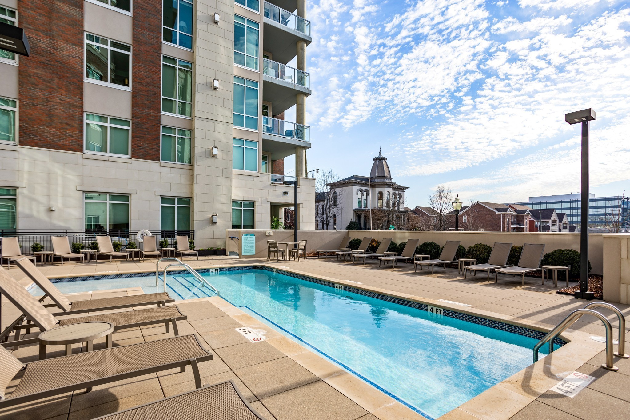20 Rutledge Street, Unit 406 Nashville, TN 37210 - Photo 51 of 75 a view of a swimming pool with a lounge chairs