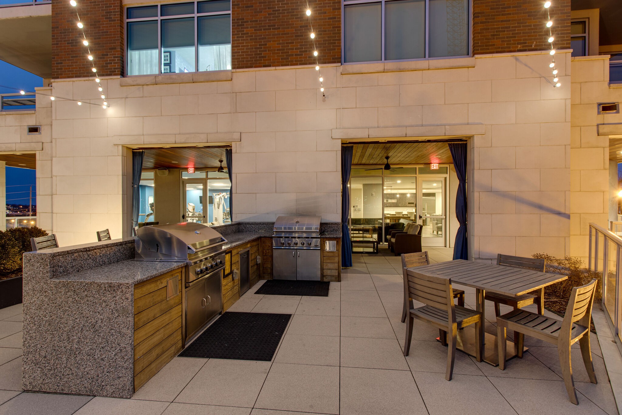 20 Rutledge Street, Unit 406 Nashville, TN 37210 - Photo 66 of 75 a kitchen with a sink and chairs