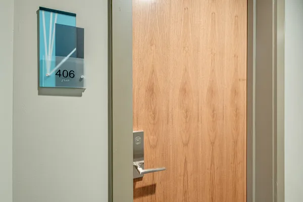a view of an entryway with wooden floor