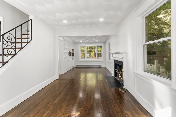 a bathroom with a sink toilet vanity and shower