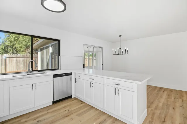 a spacious bathroom with double vanity and a large mirror