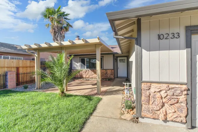 a view of a house with a garden