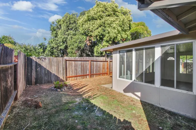 a view of a backyard with a garden