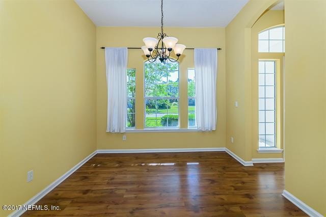 1753 Keswick Road St. Augustine, FL 32084 - Photo 3 of 26 a view of an empty room with window and wooden floor
