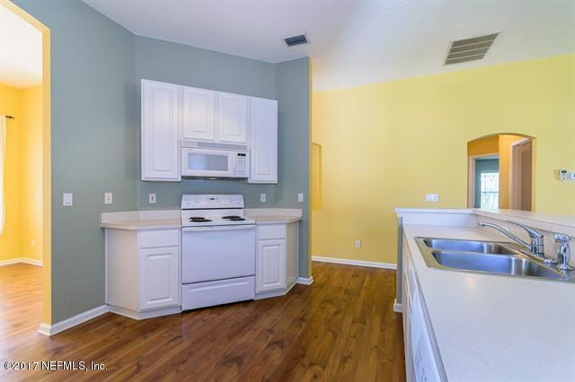 1753 Keswick Road St. Augustine, FL 32084 - Photo 9 of 26 a room with a stove and a sink