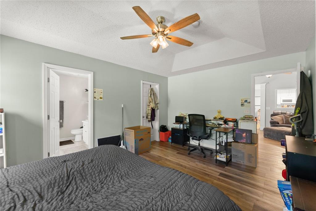 654 Marigold Lane Mount Airy, GA 30563 - Photo 17 of 27 a bed room with a bed and a chair