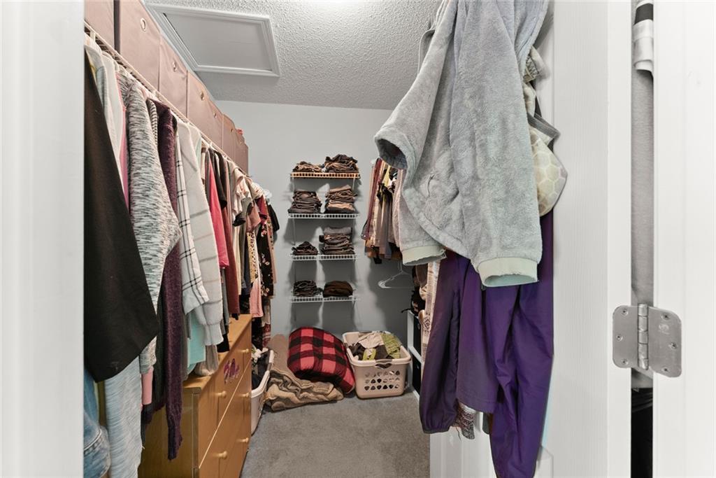 654 Marigold Lane Mount Airy, GA 30563 - Photo 18 of 27 a view of walk in closet with clothes