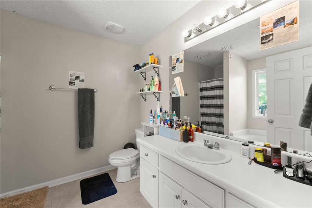 654 Marigold Lane Mount Airy, GA 30563 - Photo 19 of 27 a bathroom with a sink double vanity and a toilet