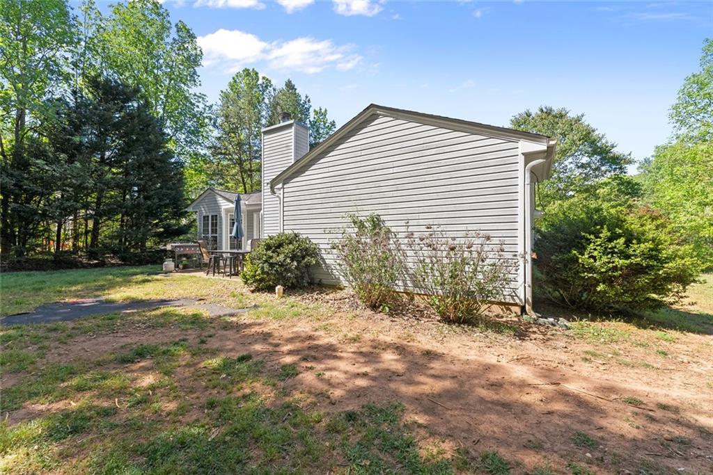 654 Marigold Lane Mount Airy, GA 30563 - Photo 22 of 27 a view of a house with backyard and trees