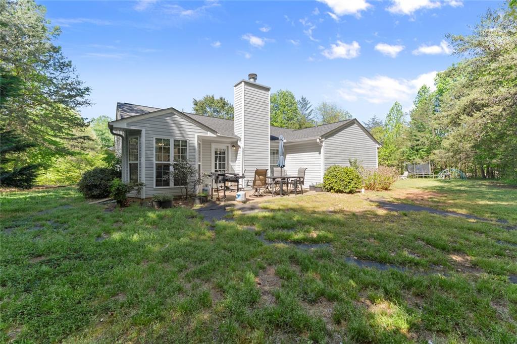 654 Marigold Lane Mount Airy, GA 30563 - Photo 24 of 27 a front view of house with yard porch and green space