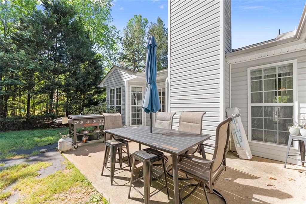 654 Marigold Lane Mount Airy, GA 30563 - Photo 25 of 27 a view of a house with backyard and sitting area