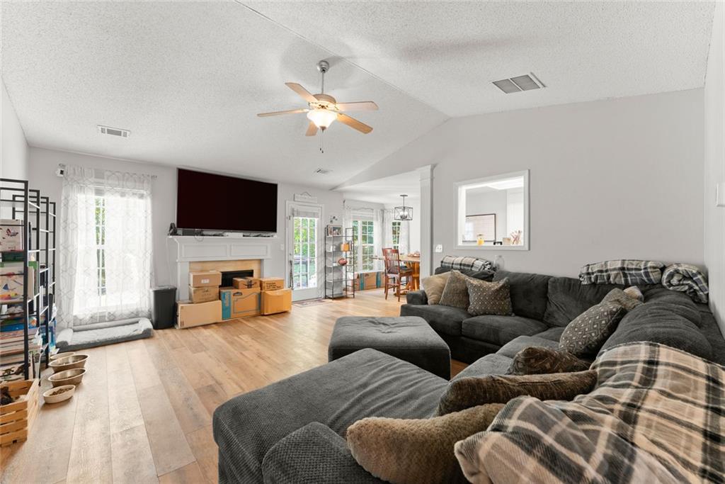 654 Marigold Lane Mount Airy, GA 30563 - Photo 4 of 27 a living room with furniture and a flat screen tv