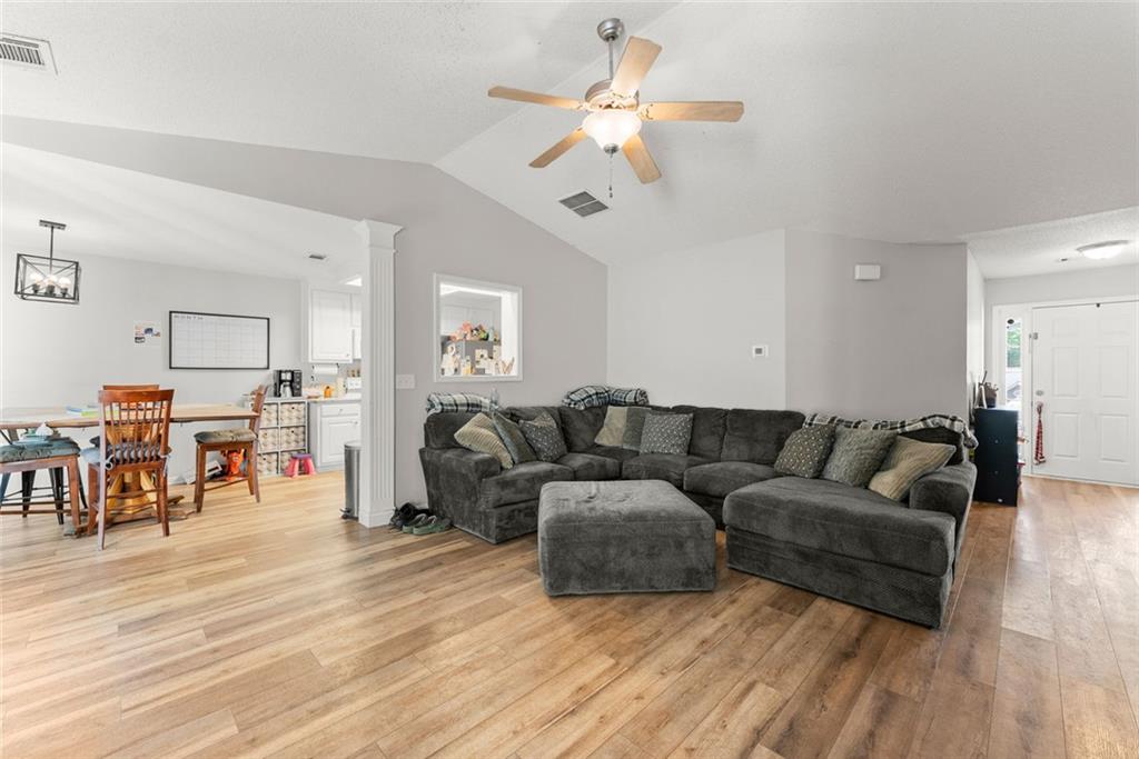 654 Marigold Lane Mount Airy, GA 30563 - Photo 6 of 27 a living room with furniture and a wooden floor