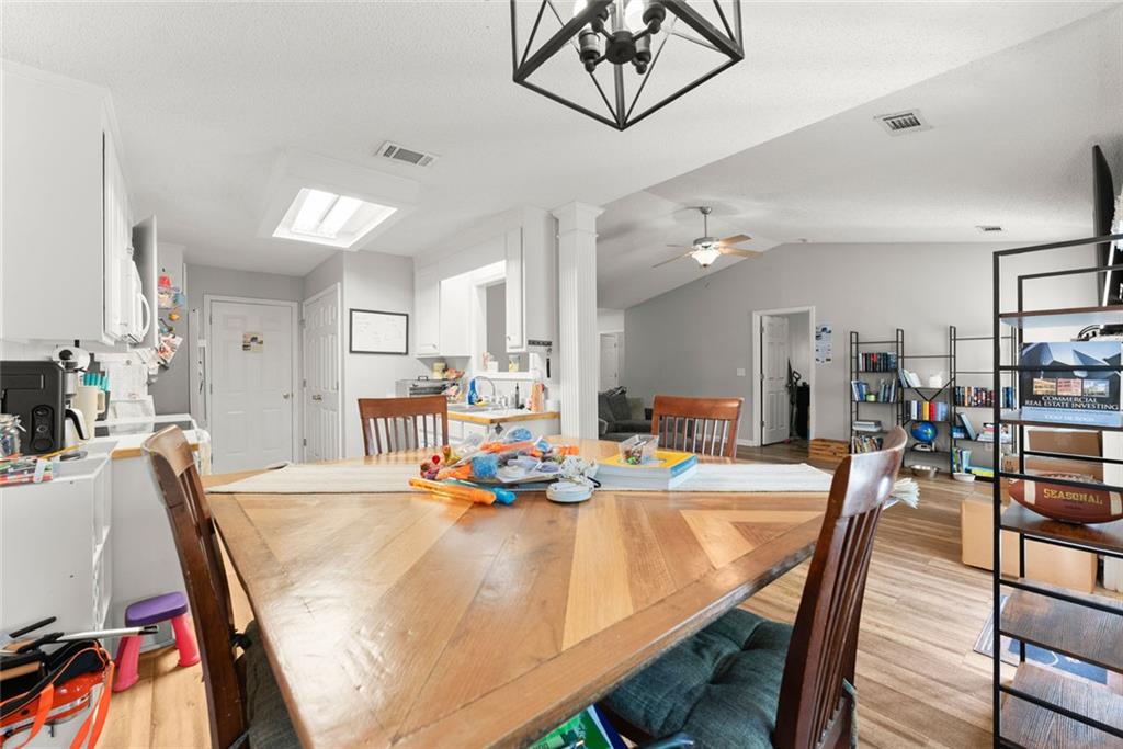 654 Marigold Lane Mount Airy, GA 30563 - Photo 8 of 27 a dining room with furniture and a view of kitchen