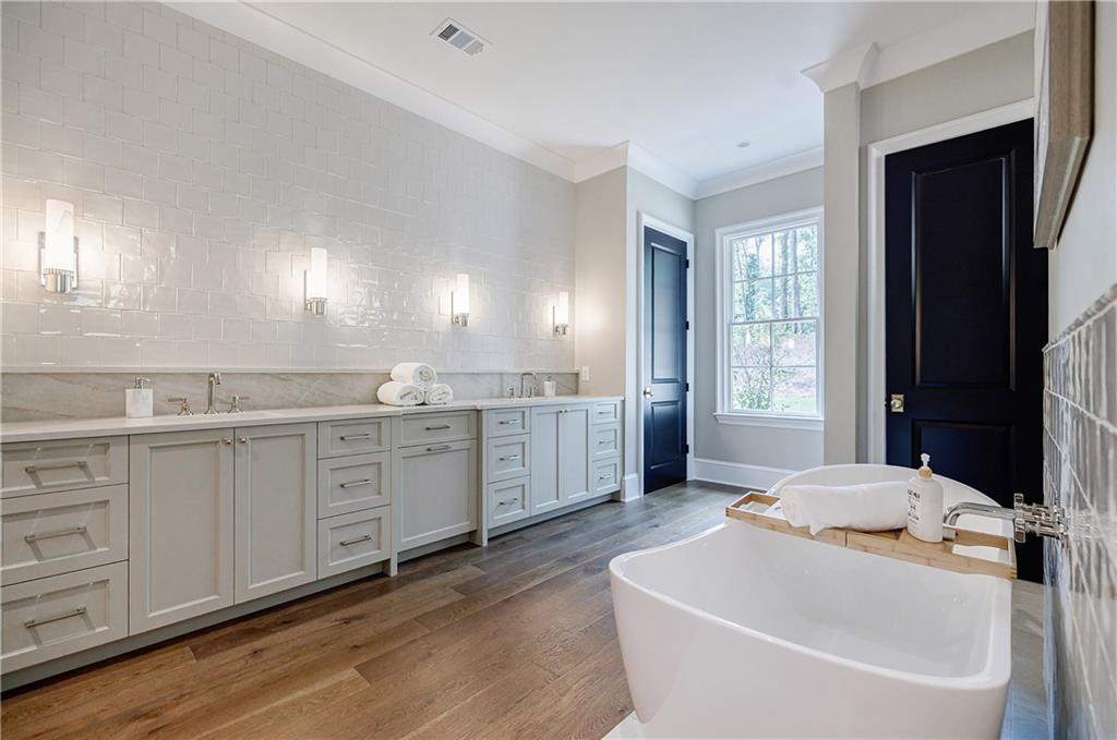 125 Laurel Brk Lane Canton, GA 30115 - Photo 21 of 50 a bathroom with a granite countertop sink mirror and bathtub