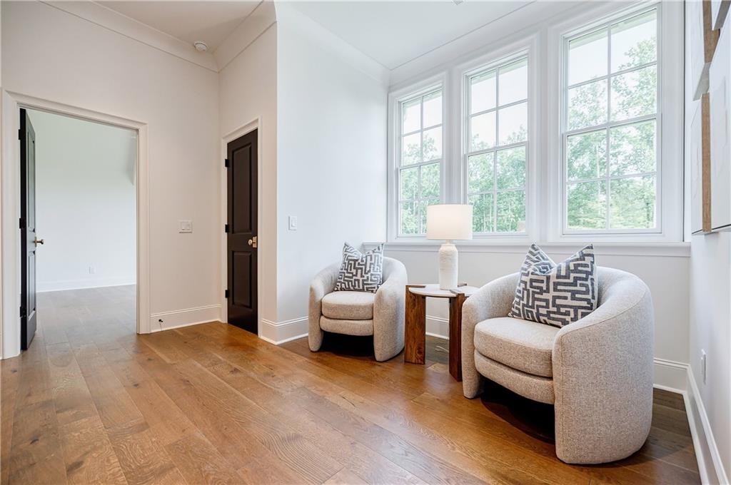 125 Laurel Brk Lane Canton, GA 30115 - Photo 32 of 50 a living room with furniture and a large window