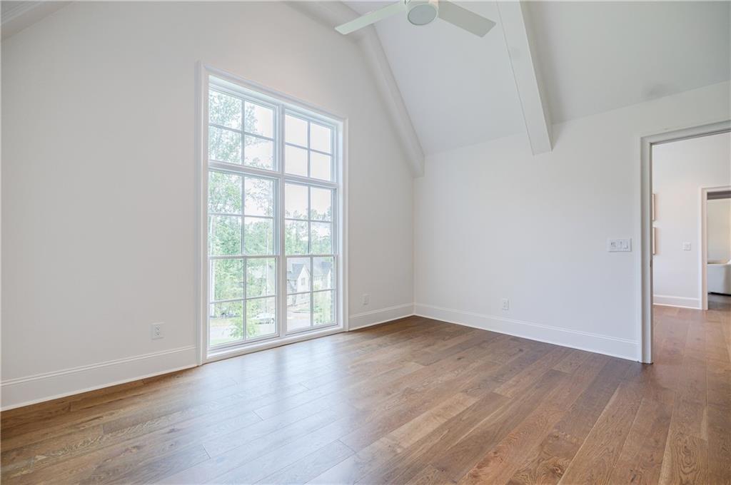 125 Laurel Brk Lane Canton, GA 30115 - Photo 34 of 50 an empty room with wooden floor and windows