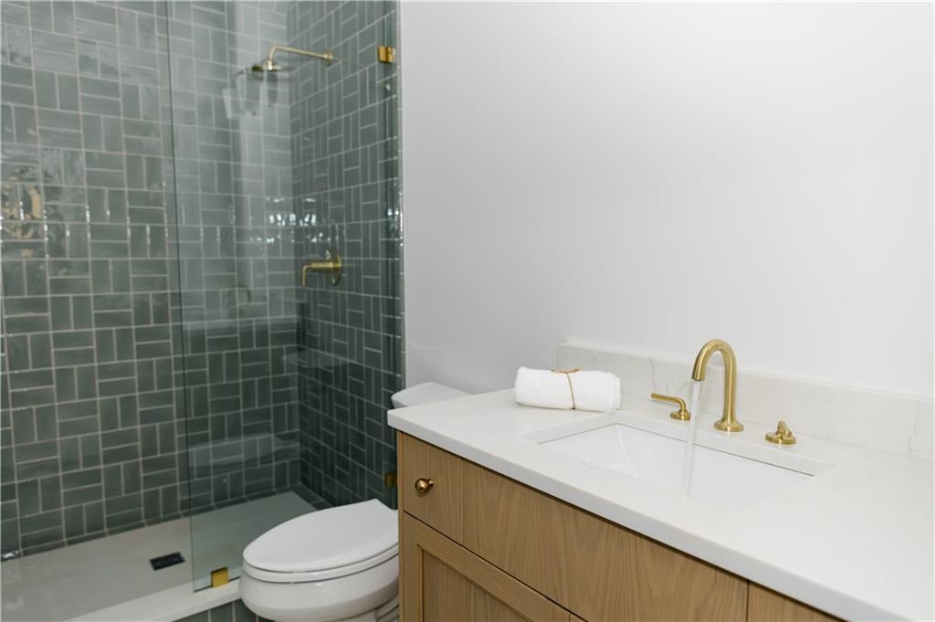 125 Laurel Brk Lane Canton, GA 30115 - Photo 37 of 50 a bathroom with a sink a toilet and shower