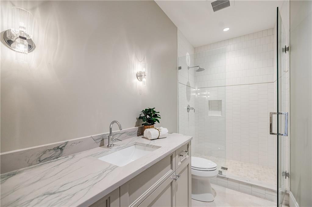 125 Laurel Brk Lane Canton, GA 30115 - Photo 39 of 50 a bathroom with a granite countertop sink mirror and toilet