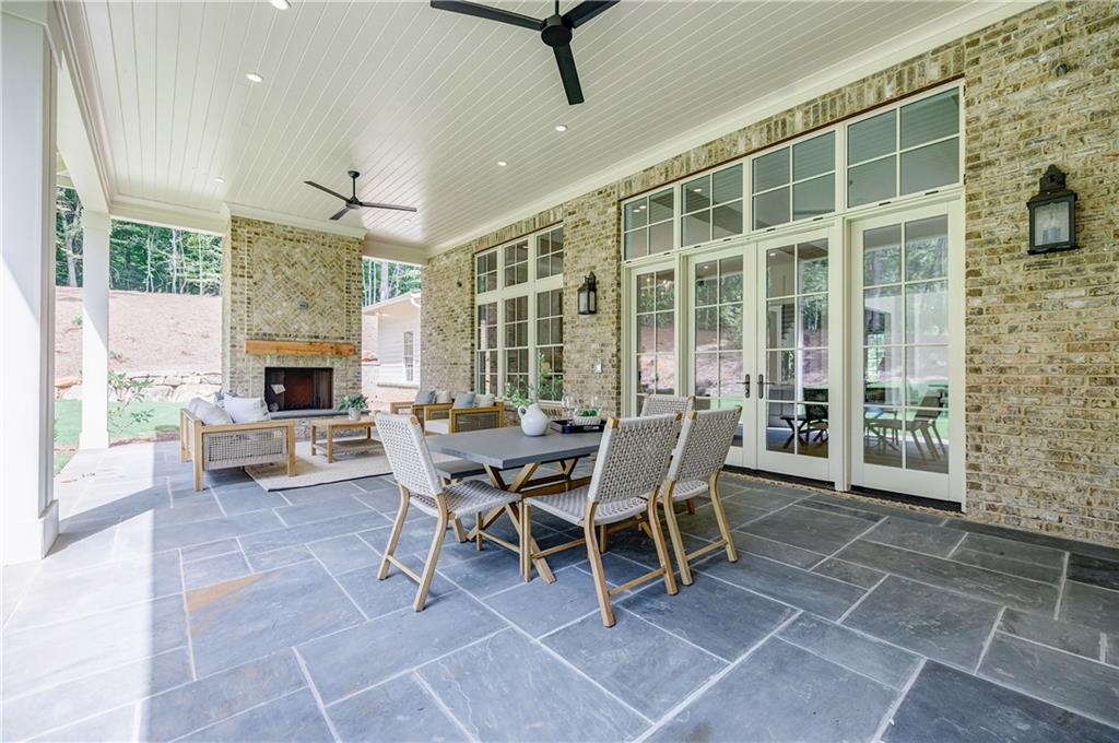 125 Laurel Brk Lane Canton, GA 30115 - Photo 43 of 50 a dining room with furniture mountain view and a fireplace