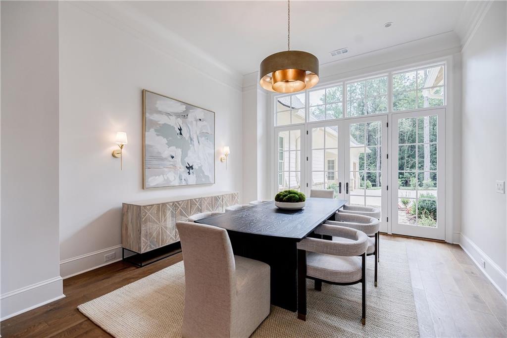 125 Laurel Brk Lane Canton, GA 30115 - Photo 9 of 50 a view of a dining room and a table chairs and wooden floor