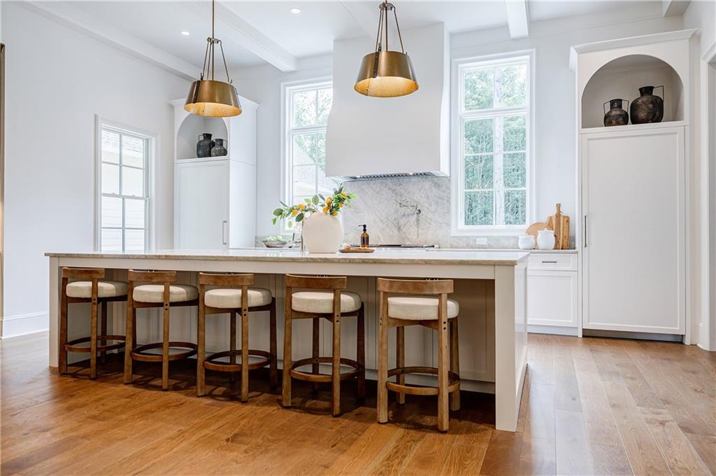 125 Laurel Brk Lane Canton, GA 30115 - Photo 10 of 50 a dining table chairs in a kitchen