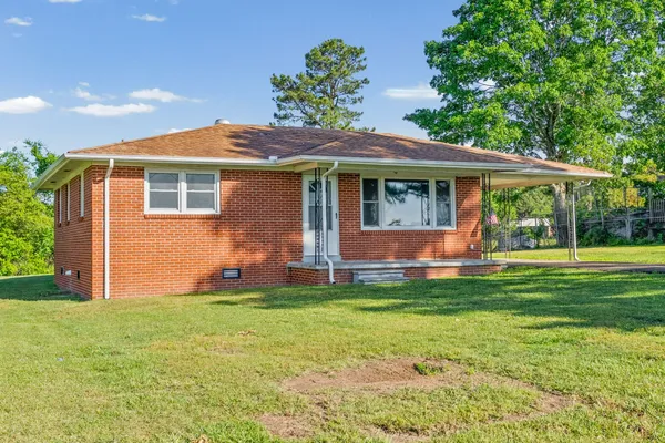 a view of a house with a yard porch and sitting area
