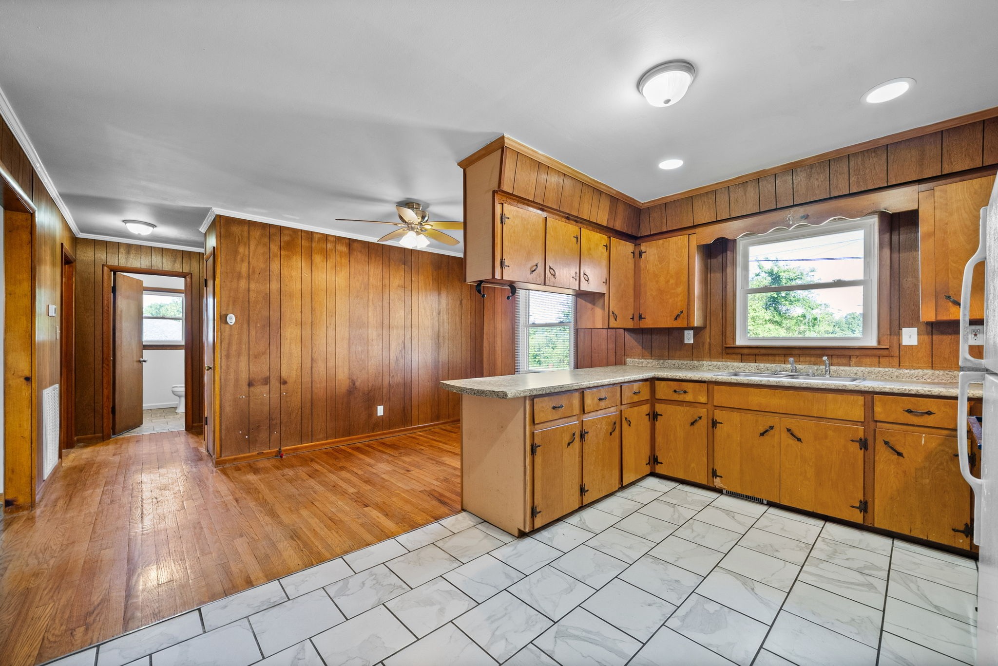 360 North Main Street Erin, TN 37061 - Photo 12 of 22 a kitchen with granite countertop sink cabinets and window