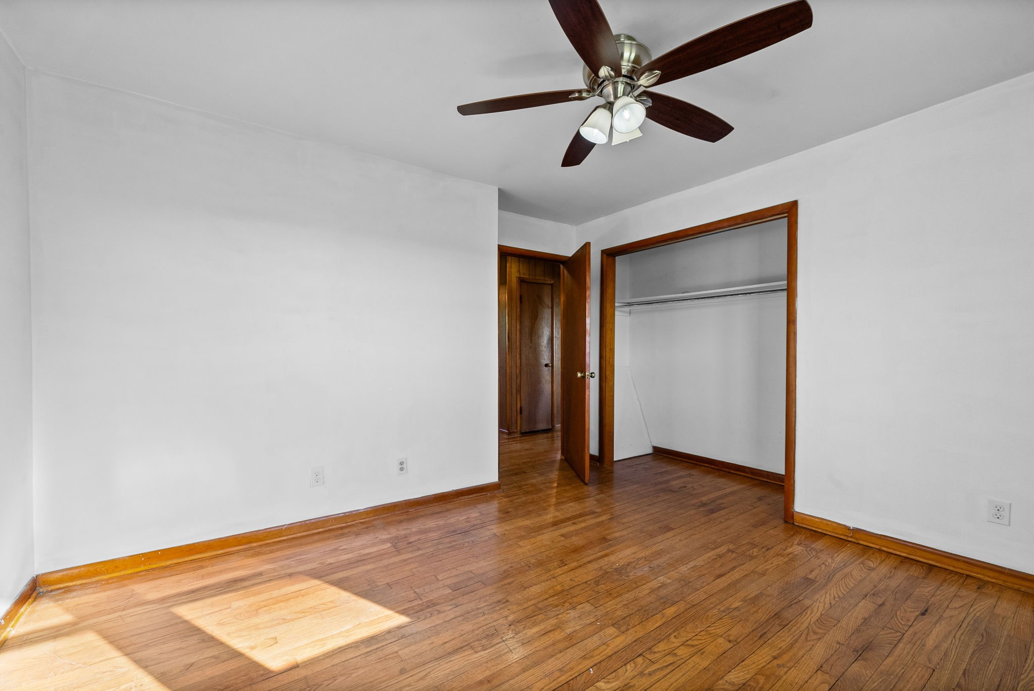 360 North Main Street Erin, TN 37061 - Photo 14 of 22 an empty room with wooden floor and windows