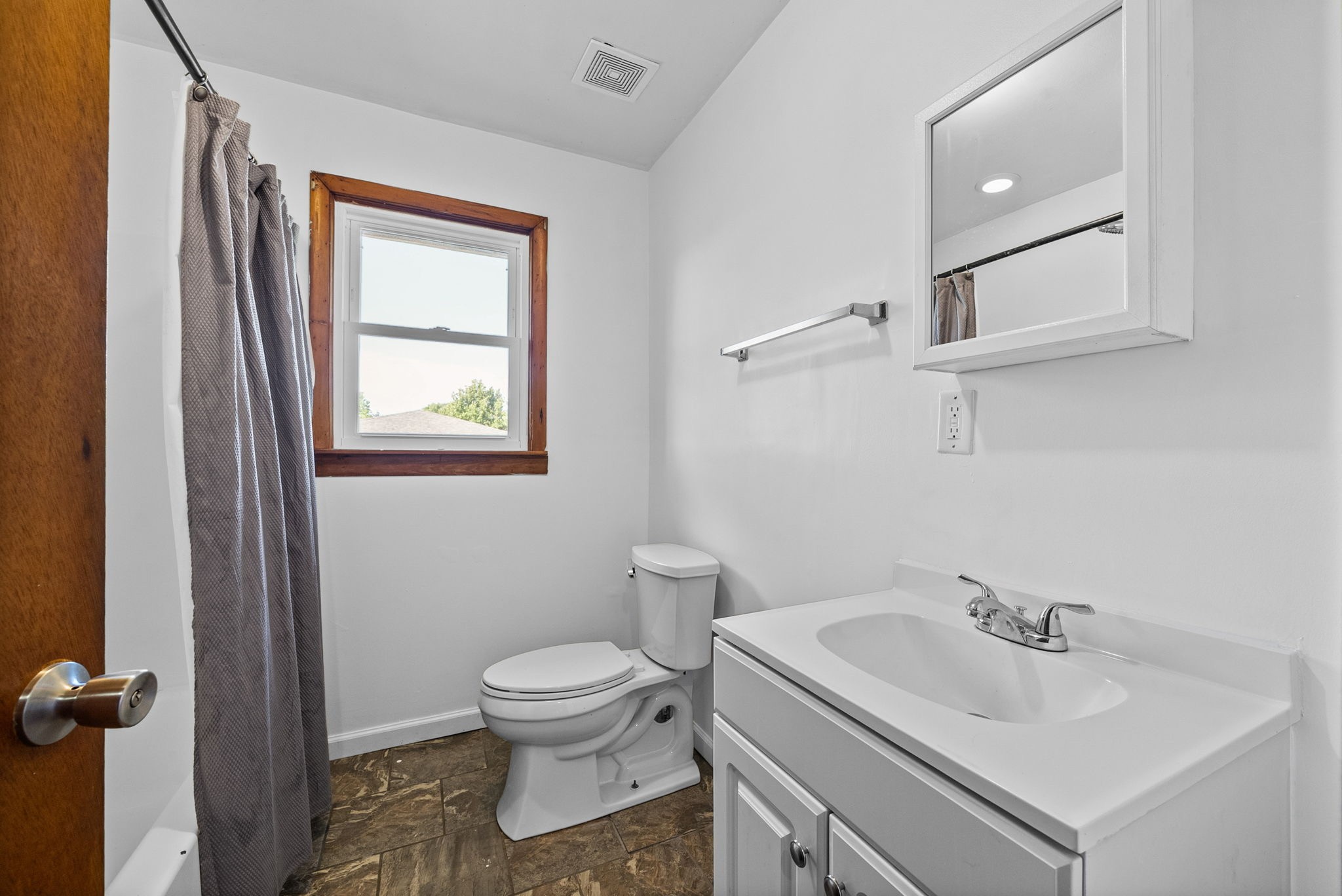 360 North Main Street Erin, TN 37061 - Photo 15 of 22 a white toilet sitting next to a bathroom sink