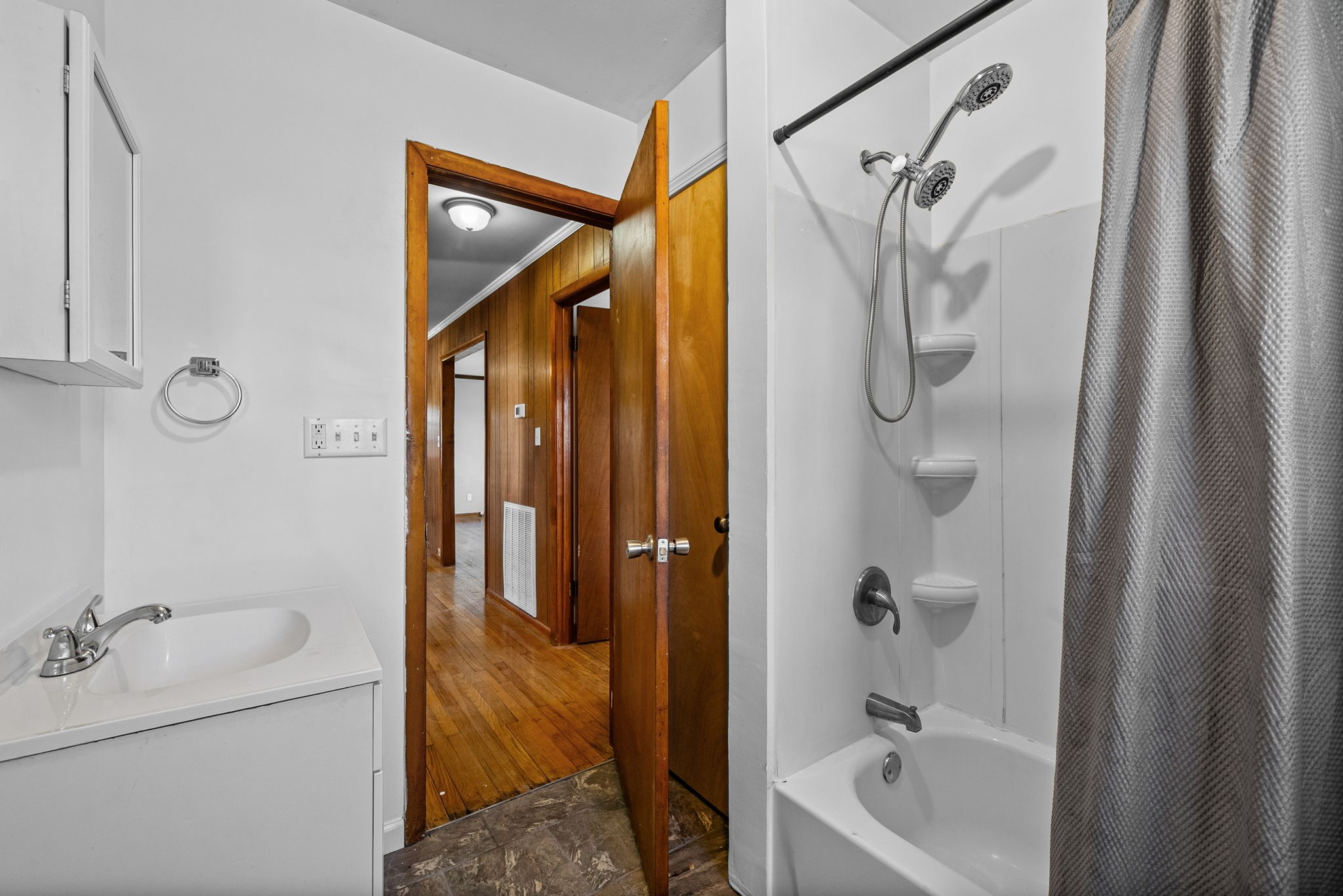 360 North Main Street Erin, TN 37061 - Photo 16 of 22 a bathroom with a tub a sink and shower