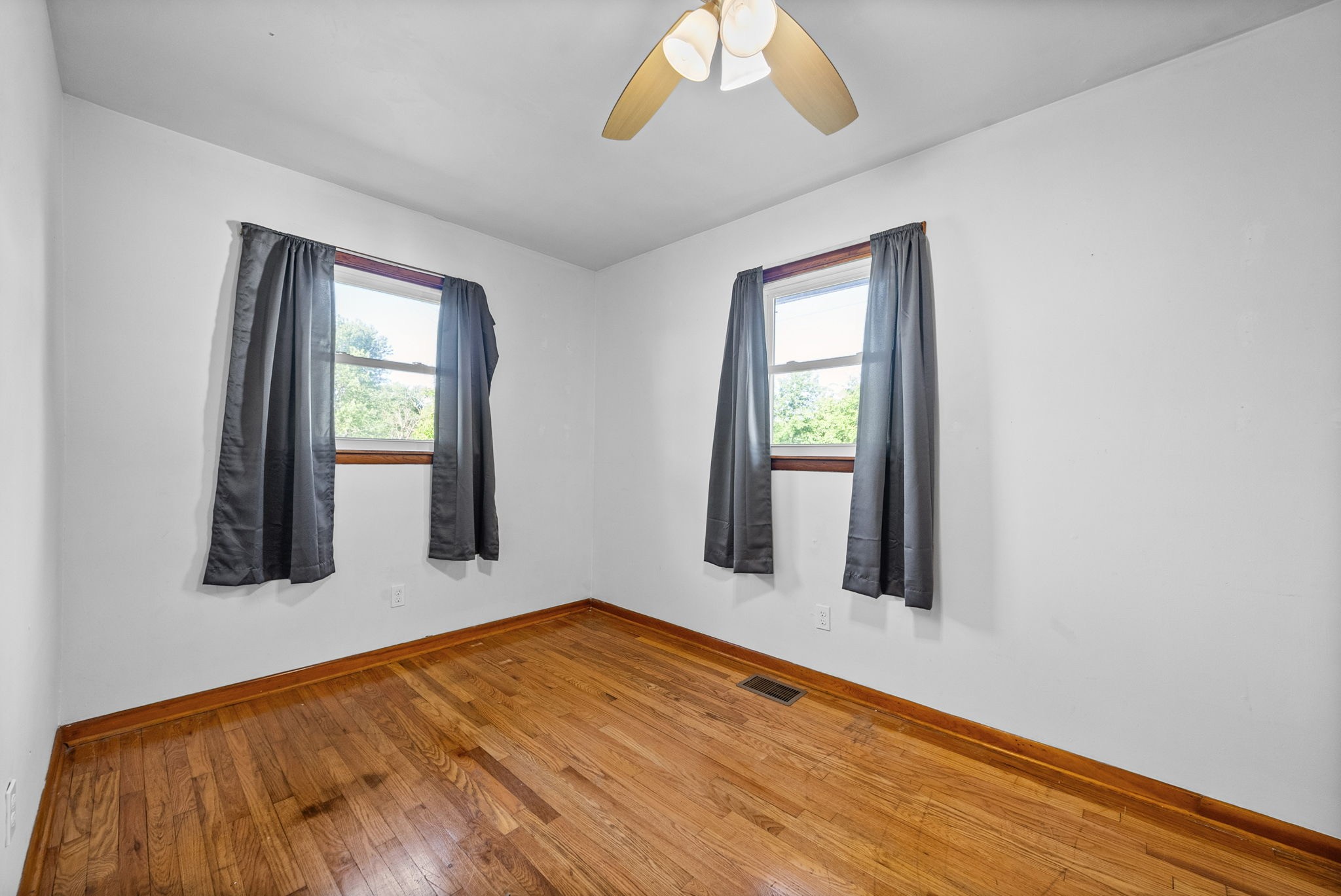 360 North Main Street Erin, TN 37061 - Photo 17 of 22 a view of an empty room with wooden floor and a window