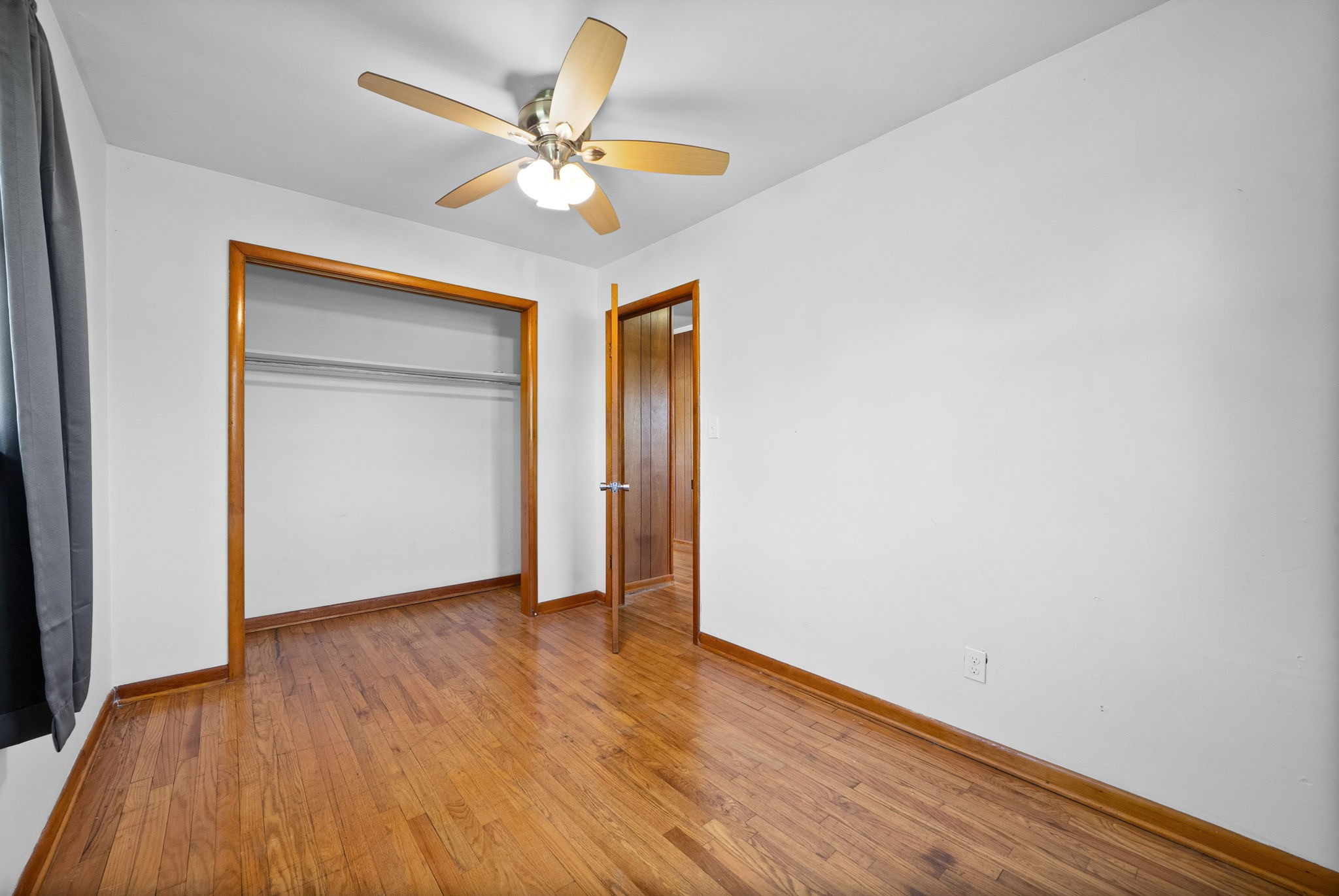 360 North Main Street Erin, TN 37061 - Photo 18 of 22 a view of an empty room with wooden floor