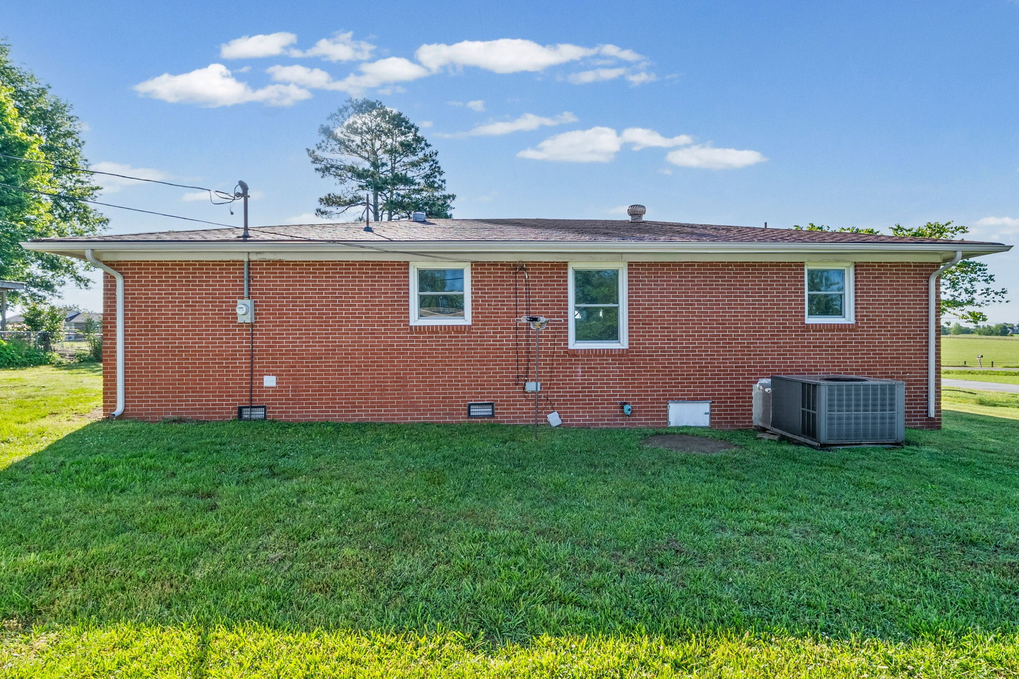 360 North Main Street Erin, TN 37061 - Photo 21 of 22 a view of a house with a backyard