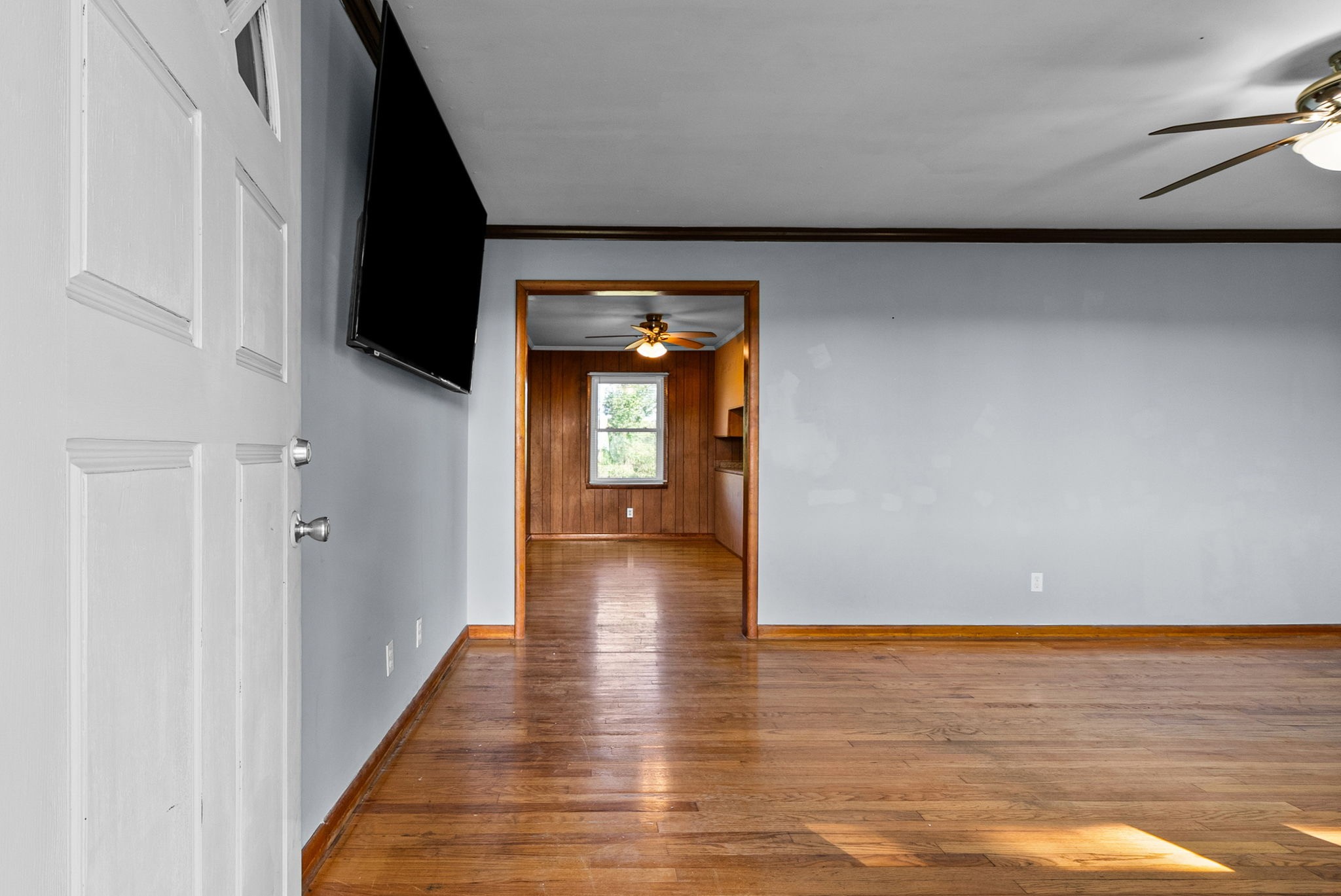 360 North Main Street Erin, TN 37061 - Photo 3 of 22 a view of a hallway with wooden floor and staircase