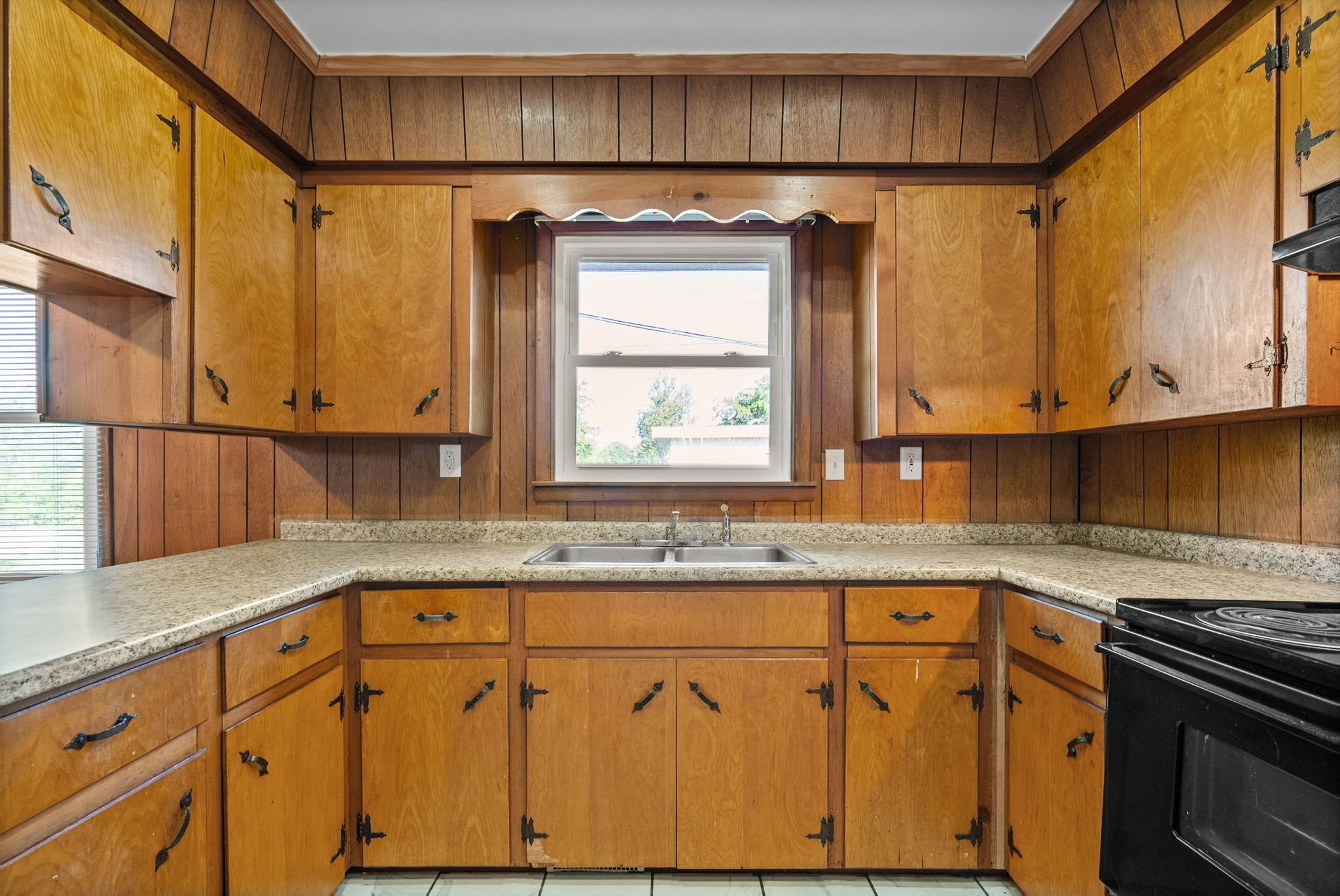 360 North Main Street Erin, TN 37061 - Photo 10 of 22 a kitchen with stainless steel appliances granite countertop a sink and a microwave