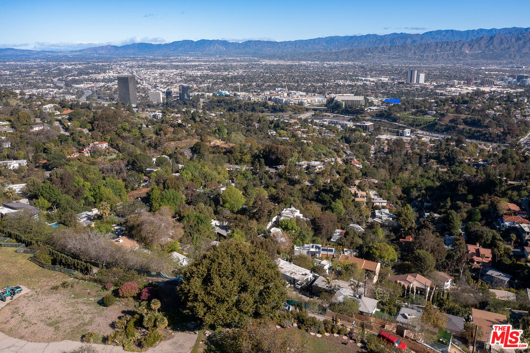 7315 Pyramid Place Los Angeles, CA 90046 - Photo 11 of 14 an aerial view of house with yard and mountain view in back