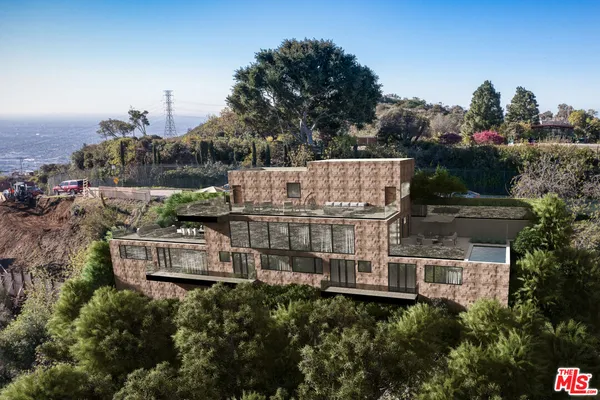 an aerial view of a house with outdoor space