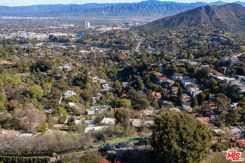 an aerial view of residential house and green space