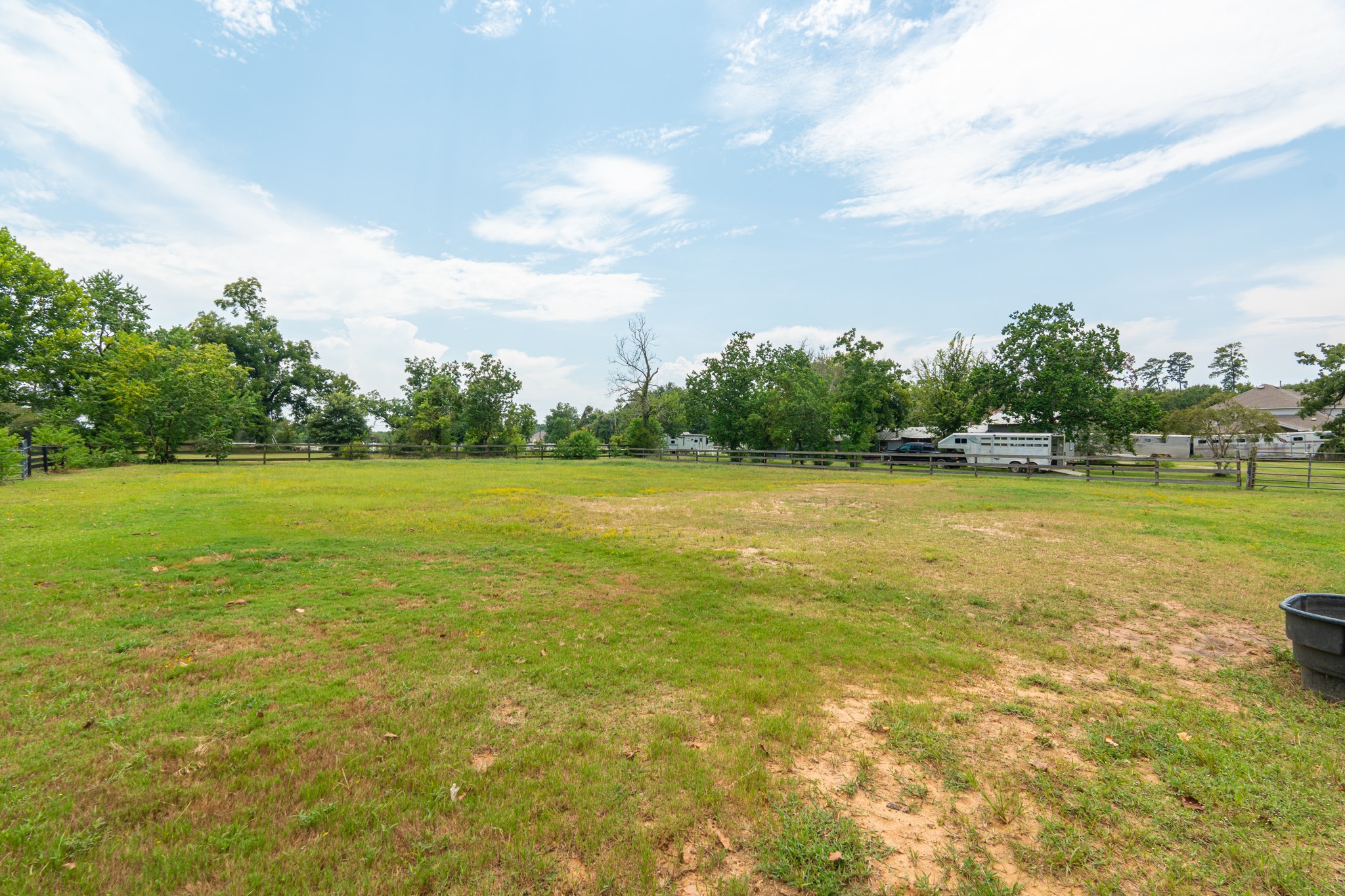 25635 Hufsmith Cemetery Road Tomball, TX 77375 - Photo 37 of 50 This open pasture view captures the very heart of what makes this Tomball acreage so extraordinary — wide, level fields with rich green Texas grass, clean blue skies, and the deep quiet of genuine country living. Whether for horses, cattle, hobby farming, or simply the joy of open space, this beautiful land is ready and waiting to welcome you home.