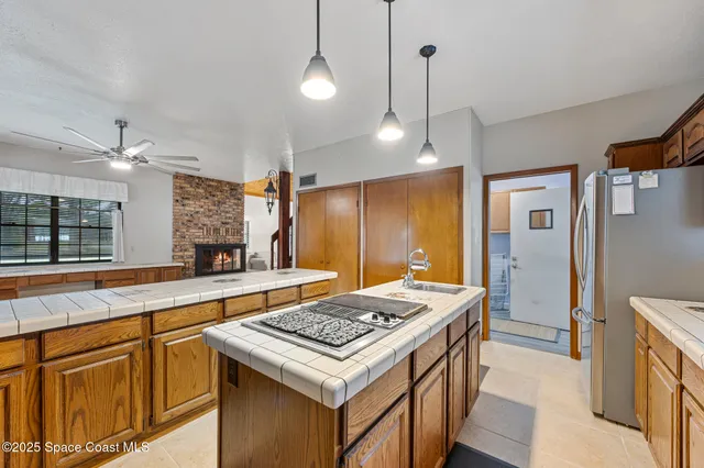 a kitchen that has a stove and a table in it