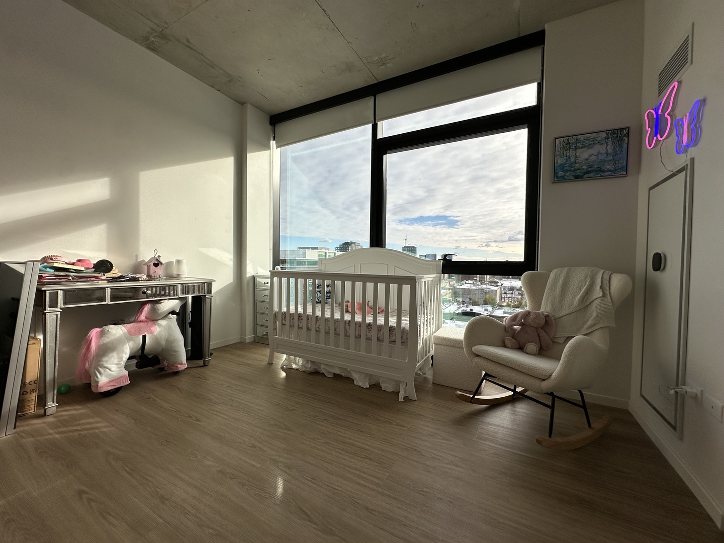 225 North Elizabeth Street, Unit 709 Chicago, IL 60607 - Photo 11 of 31 a view of a room with gym equipment and a large window