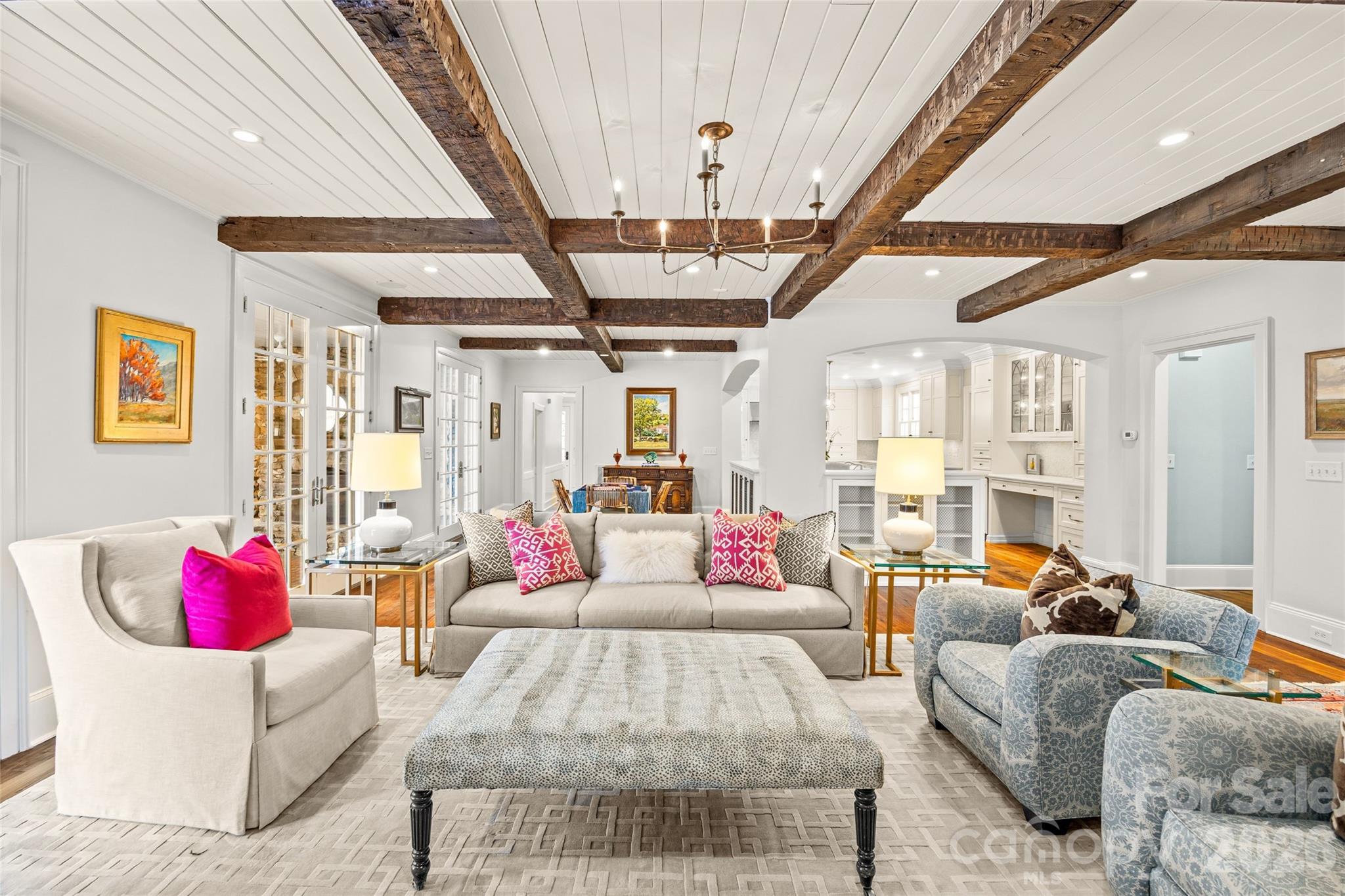 640 Colville Road Charlotte, NC 28207 - Photo 11 of 48 a living room with furniture and a chandelier