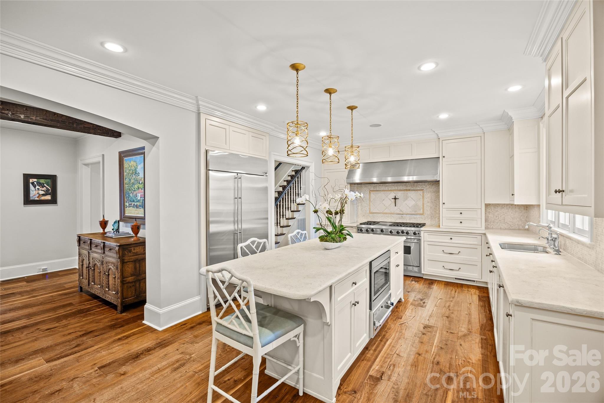 640 Colville Road Charlotte, NC 28207 - Photo 14 of 48 a large kitchen with kitchen island a large island in the center