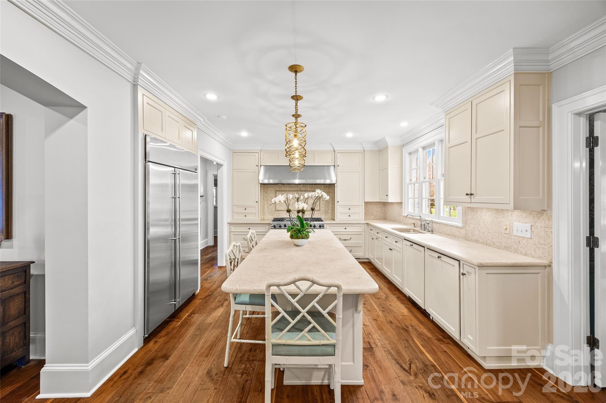 640 Colville Road Charlotte, NC 28207 - Photo 15 of 48 a large white kitchen with a large window