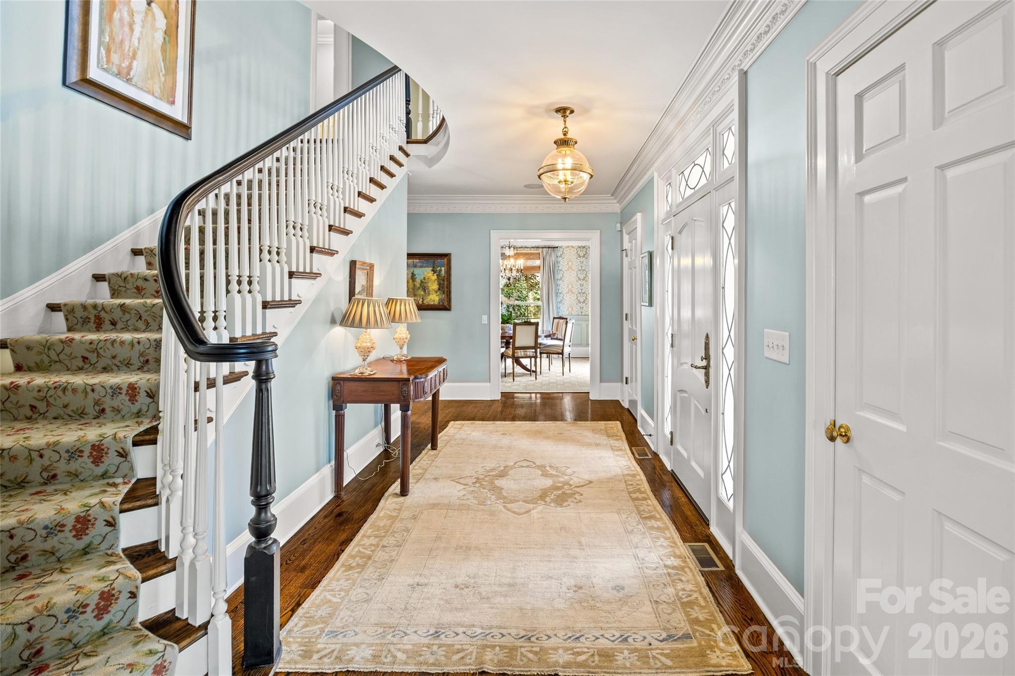 640 Colville Road Charlotte, NC 28207 - Photo 2 of 48 a view of a hallway with wooden floor and staircase