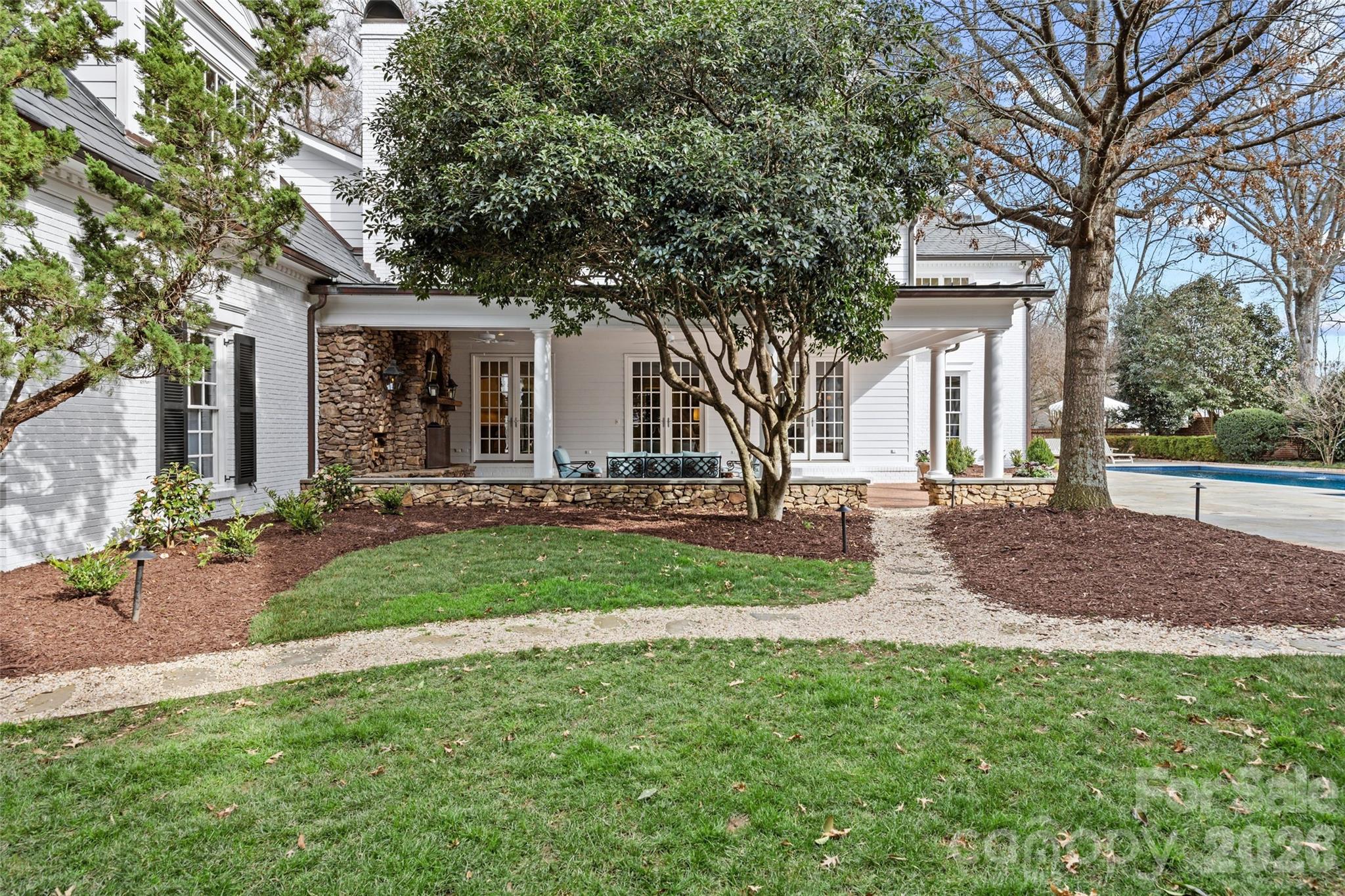640 Colville Road Charlotte, NC 28207 - Photo 30 of 48 a view of a house with backyard and tree