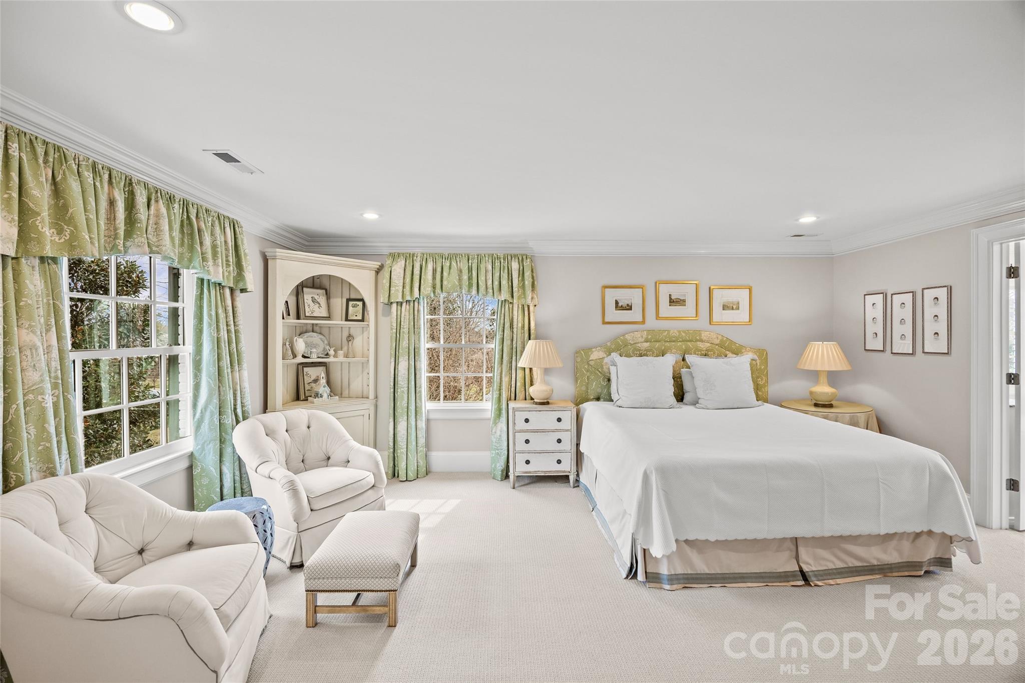 640 Colville Road Charlotte, NC 28207 - Photo 34 of 48 a bedroom with a large bed couch and a large window