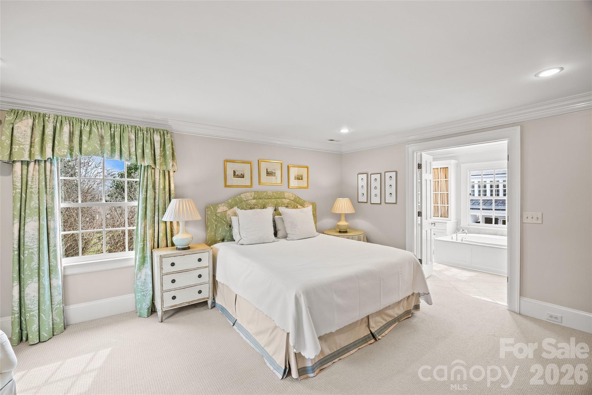 640 Colville Road Charlotte, NC 28207 - Photo 35 of 48 a bedroom with a bed and a large window