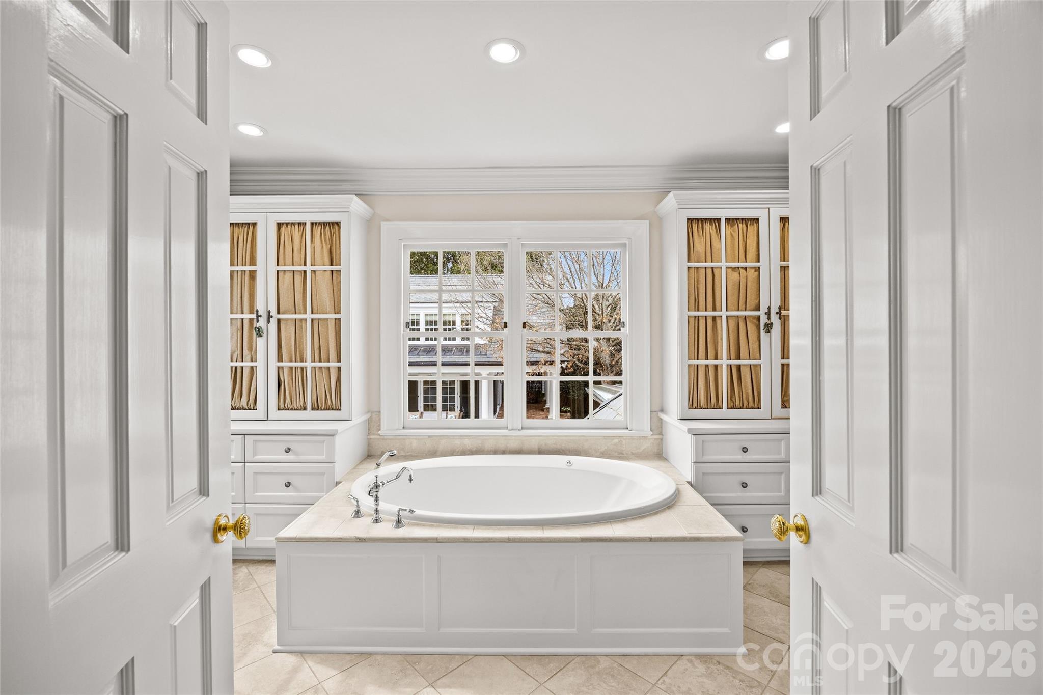 640 Colville Road Charlotte, NC 28207 - Photo 36 of 48 a bathroom with a tub sitting next to a window